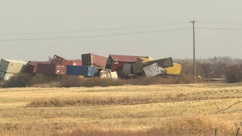 Freight cars are piled up at the scene of a derailment near Gerald, Sask.