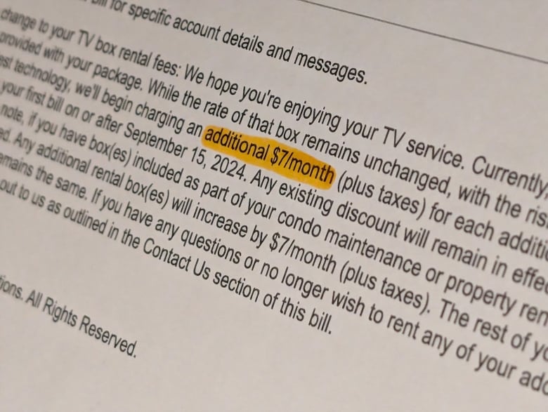 A closeup of a document -- the words 'additional $7/month' are highlighted.