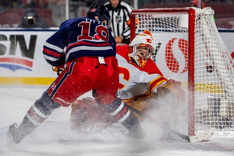 A hockey player scores a goal 