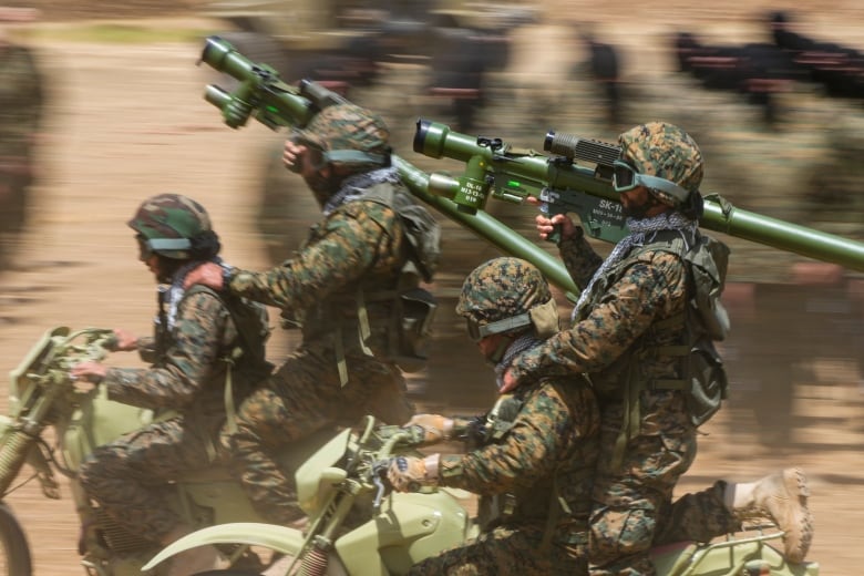 Fighters from the Lebanese militant group Hezbollah train in Aaramta village in the Jezzine District, southern Lebanon, Sunday, May 21, 2023