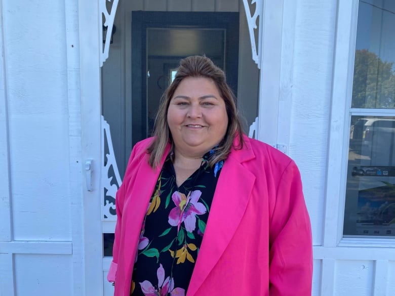 A woman standing in front of a door