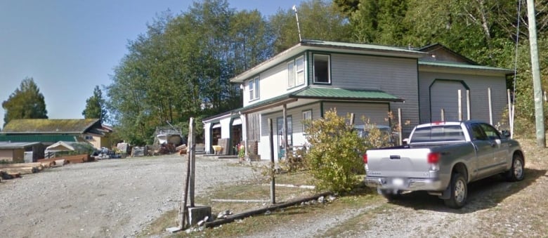 A hardware shop with a pickup truck parked nearby.