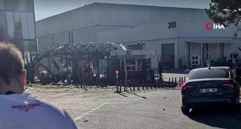 A badly damaged exit gate at an aviation facilty.