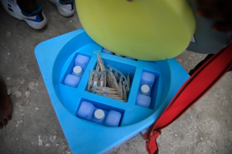 Oral cholera vaccines sit in a cooler during a cholera vaccination campaign in Haiti in 2022.