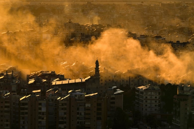 Smoke rises from the site of an Israeli airstrike in Dahiyeh, in the southern suburbs of Beirut.