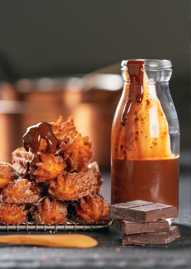 Churros drizzled with chocolate