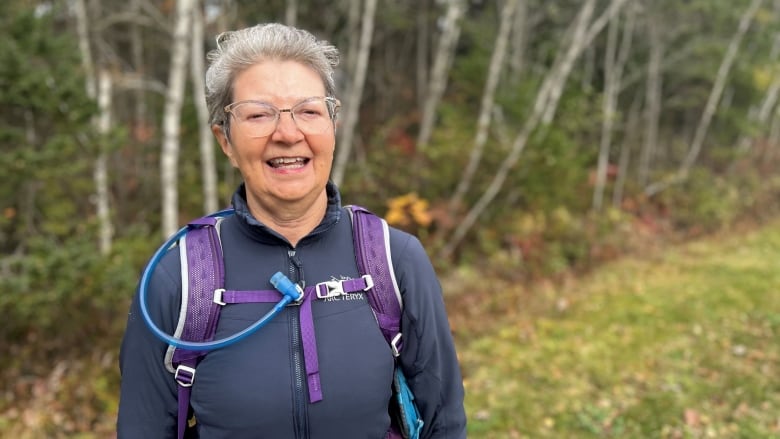 Anna Marie Kaiser with birch trees in the background.