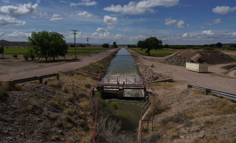 Water flows through an irrigation canal in New Mexico.