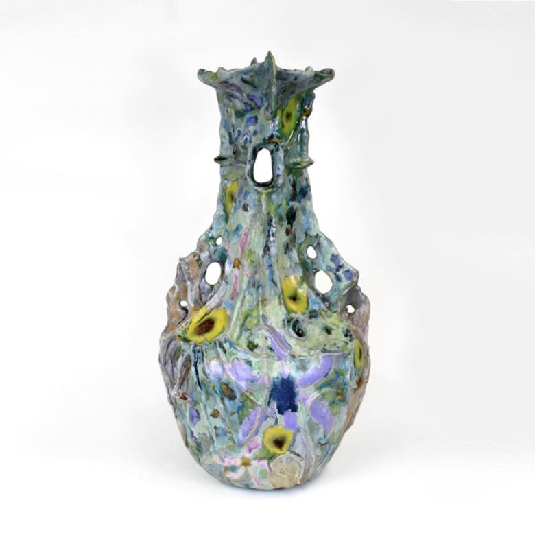 Ceramic vase with blobby colourful glaze.