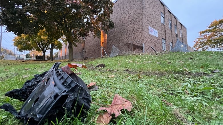 The scene at Dixon Grove Middle School early Monday after a vehicle believed to be involved in a shooting downtown crashed into the school and caught fire.