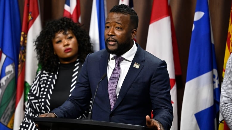 Nicholas Marcus Thompson, right, executive director of the Black Class Action Secretariat, and Bernadeth Betchi, CHRC employee and representative plainti, participate in a news conference on the Global Alliance of National Human Rights Institutions' Special Review of the accreditation of the Canadian Human Rights Commission, on Parliament Hill, in Ottawa, Monday, June 10, 2024.