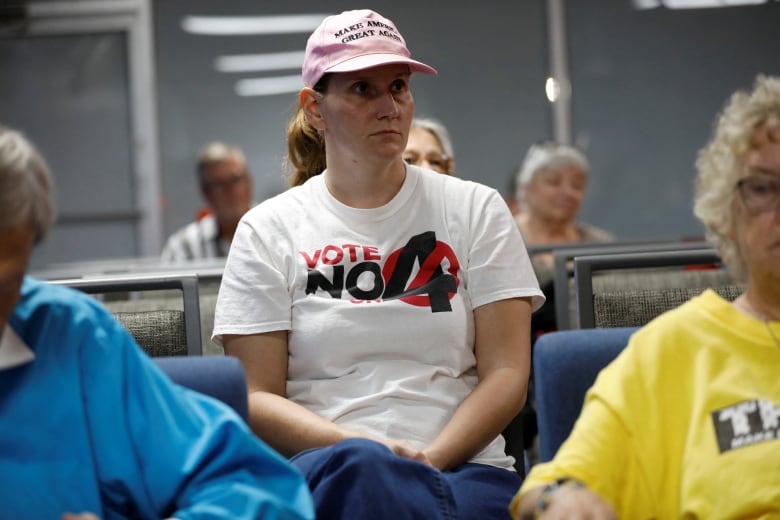 Ashley Urban, wearing a 'Vote No' on Florida Amendment 4 shirt, which addresses the states abortion bill, gathers with other parishioners for an Election Eve Service of Prayer, in support of Republican Presidential nominee and former U.S. President Donald Trump at Suncoast Liberty Fellowship in Largo, Florida, U.S., November 4, 2024. REUTERS/Octavio Jones