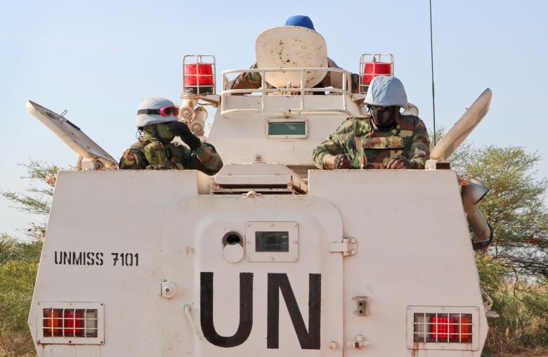 troops in a UN vehicle