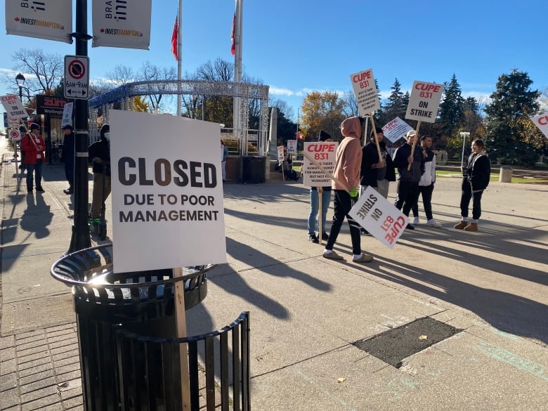 Members of CUPE Local 831 walk a picket line in Brampton on Thursday.