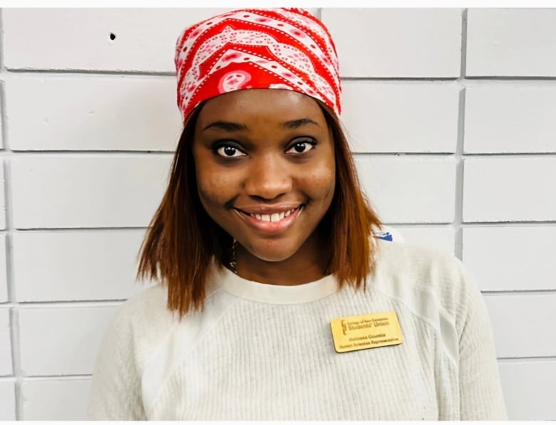 A smiling young woman.