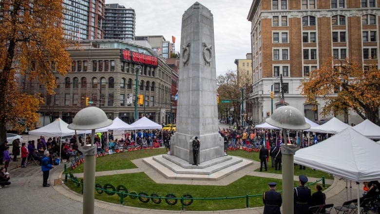 Veterans and spectators attend a National Indigenous Veterans Day ceremony at the Victory Square Cenotaph in Vancouver.