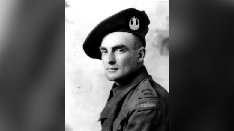 A black and white headshot of a soldier.