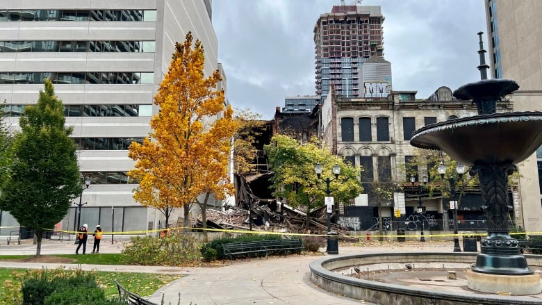 building collapse with fountain in foreground