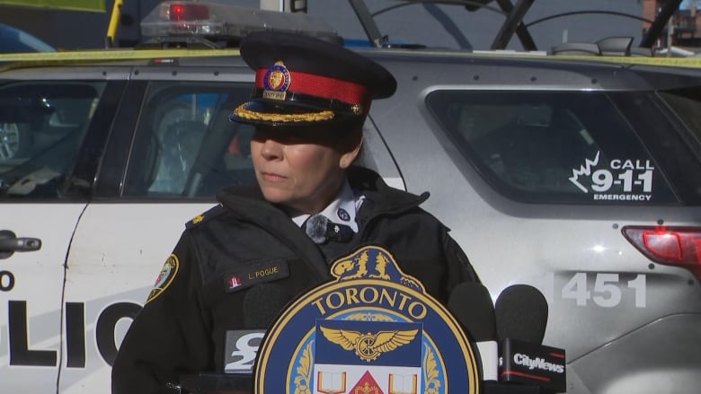 Photo of a police officer talking to media 