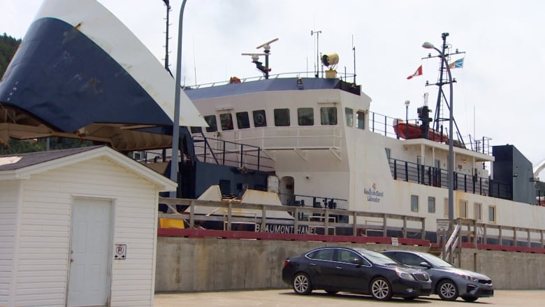 A ferry with its ramp up at the dock in Portugal Cove.