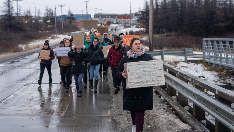 Woman leads group of protesters