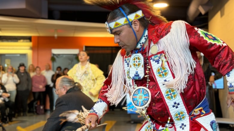 A man performs for an audience