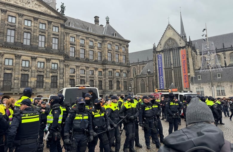 Pro-Palestinian protesters face Dutch police while taking part in a banned demonstration in Amsterdam, Netherlands November 10, 2024.