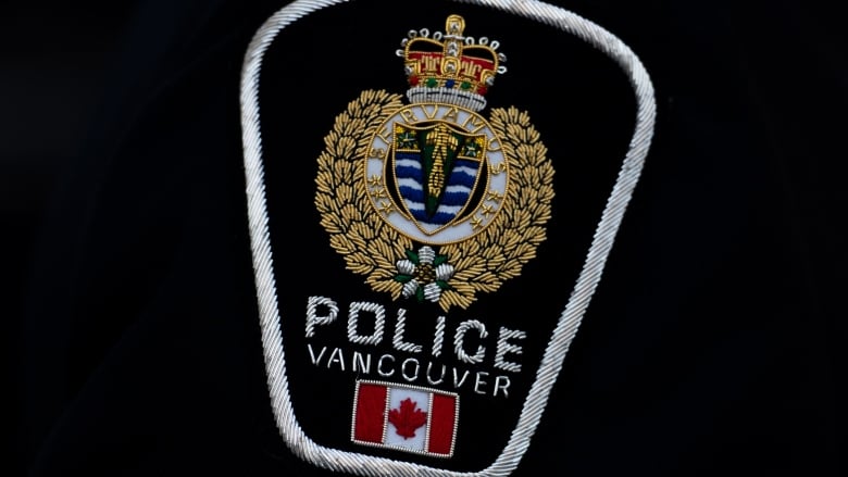 A police badge is seen with the wording 'Police Vancouver.'