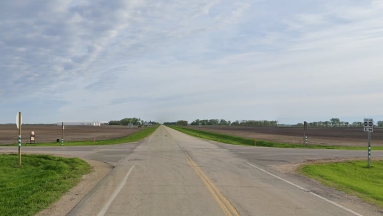 A highway intersection in a rural area is shown.