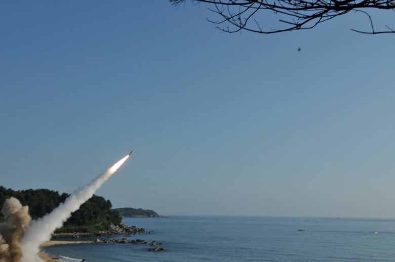 FILE PHOTO: United States and South Korean troops utilizing the Army Tactical Missile System (ATACMS) and South Korea's Hyunmoo Missile II, fire missiles into the waters of the East Sea, off South Korea, July 5, 2017.  