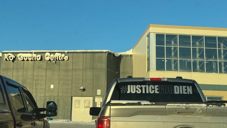 Car parked in front of a building.