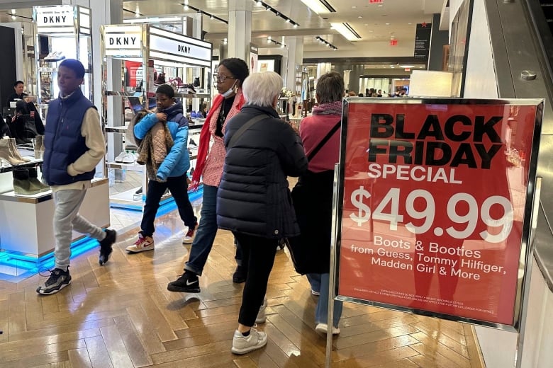 Black Friday shoppers walk through Macy's in Herald Square on Friday, Nov. 24, 2023, in New York. 