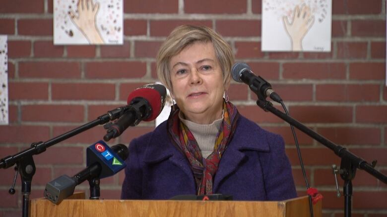 Woman speaking at podium